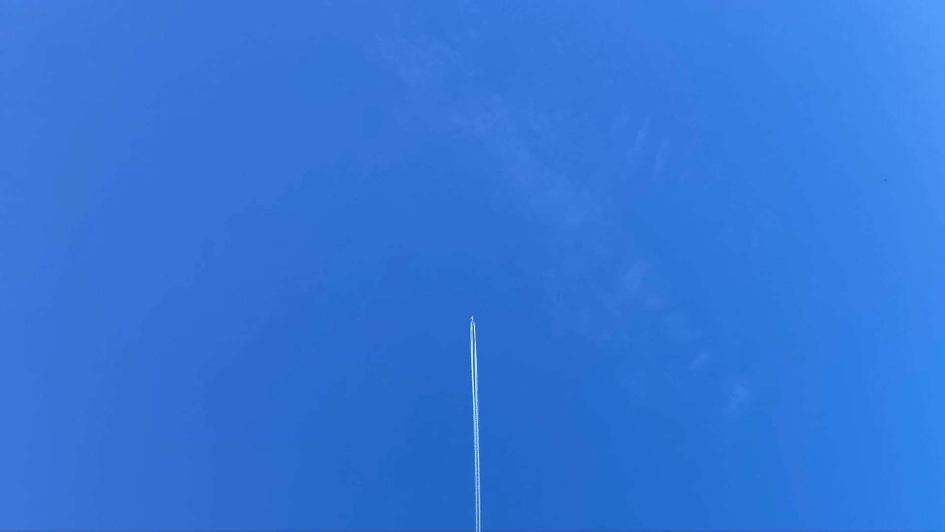 A plane going straight up into the sky.