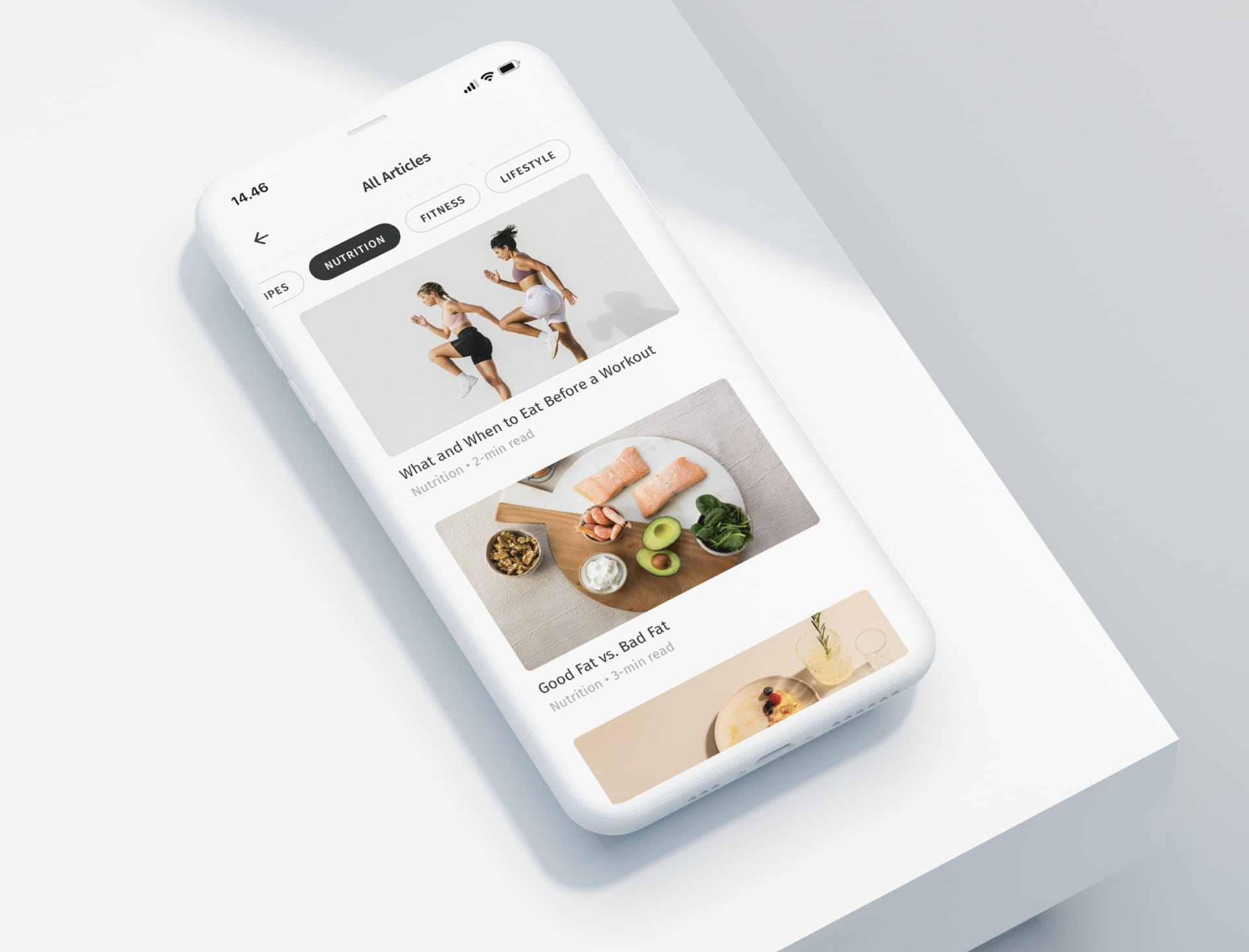 Smartphone displaying a fitness app with nutrition articles, featuring workout tips and healthy food images on a light background.