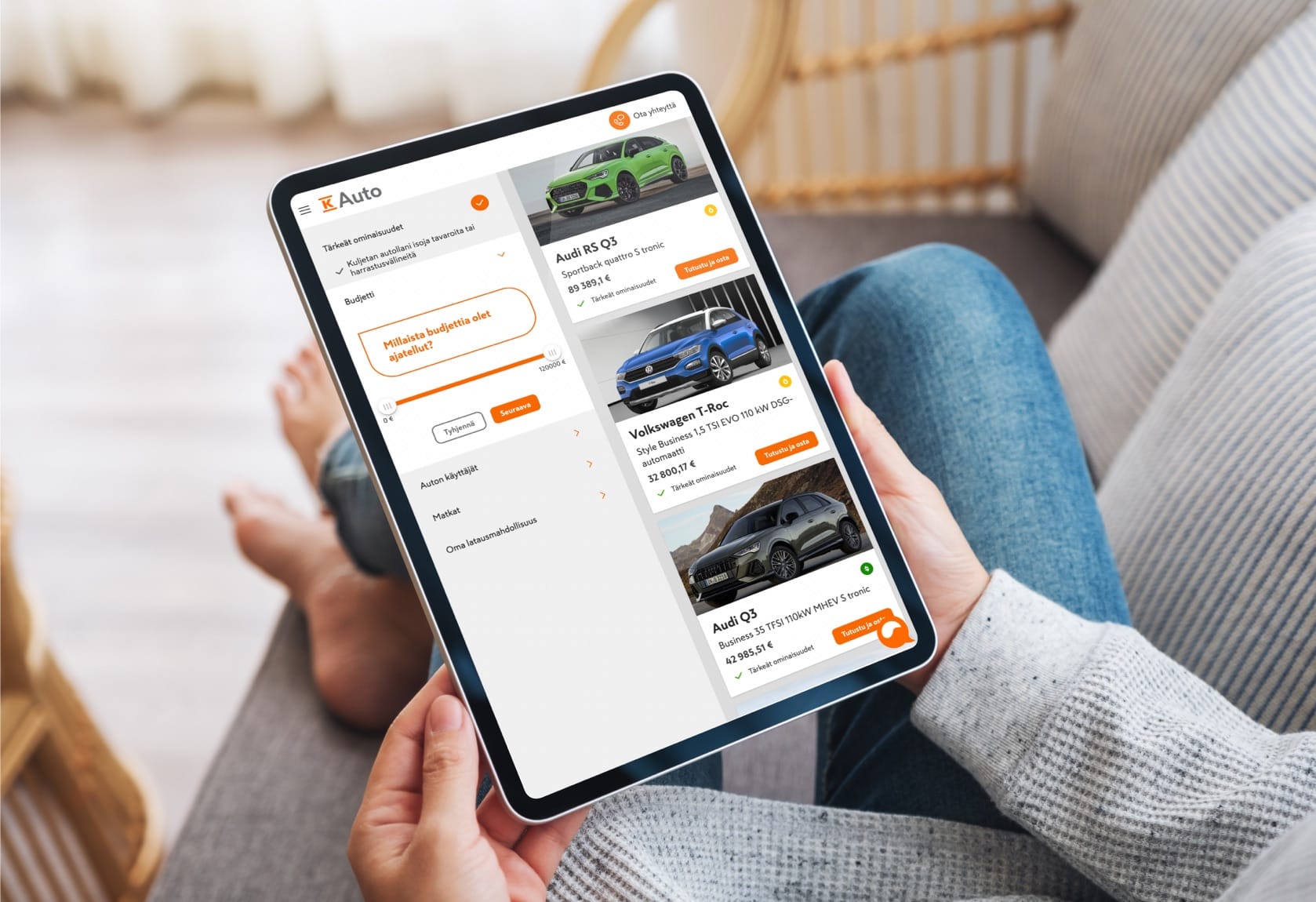 Person browsing car listings on tablet, showing Audi RS Q3 and Volkswagen T-Roc models with prices in euros.